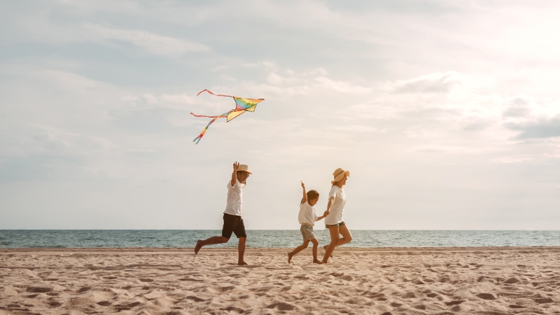 Family running on beach