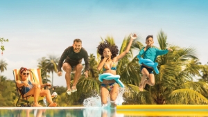 Family jumping in a pool