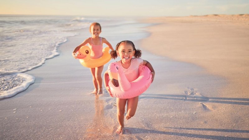 Kids running on the beach