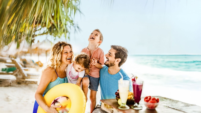 Family having fun on the beach
