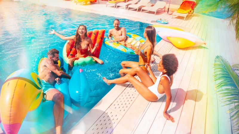 Group of adults smiling in a pool