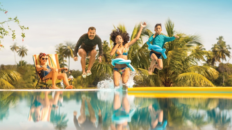 Family jumping in a pool