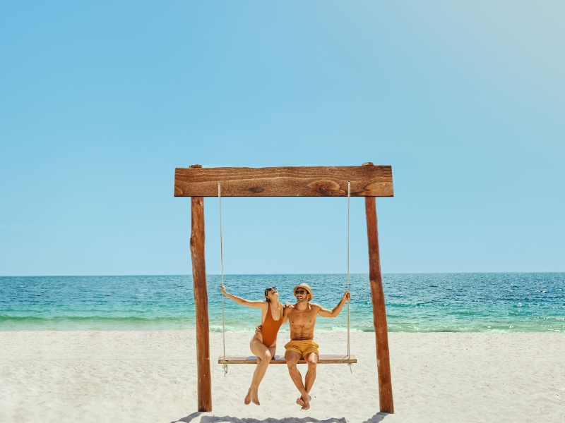 Couple on swing at Grand Palladium Select Costa Mujeres