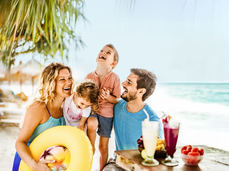 Family having fun on the beach
