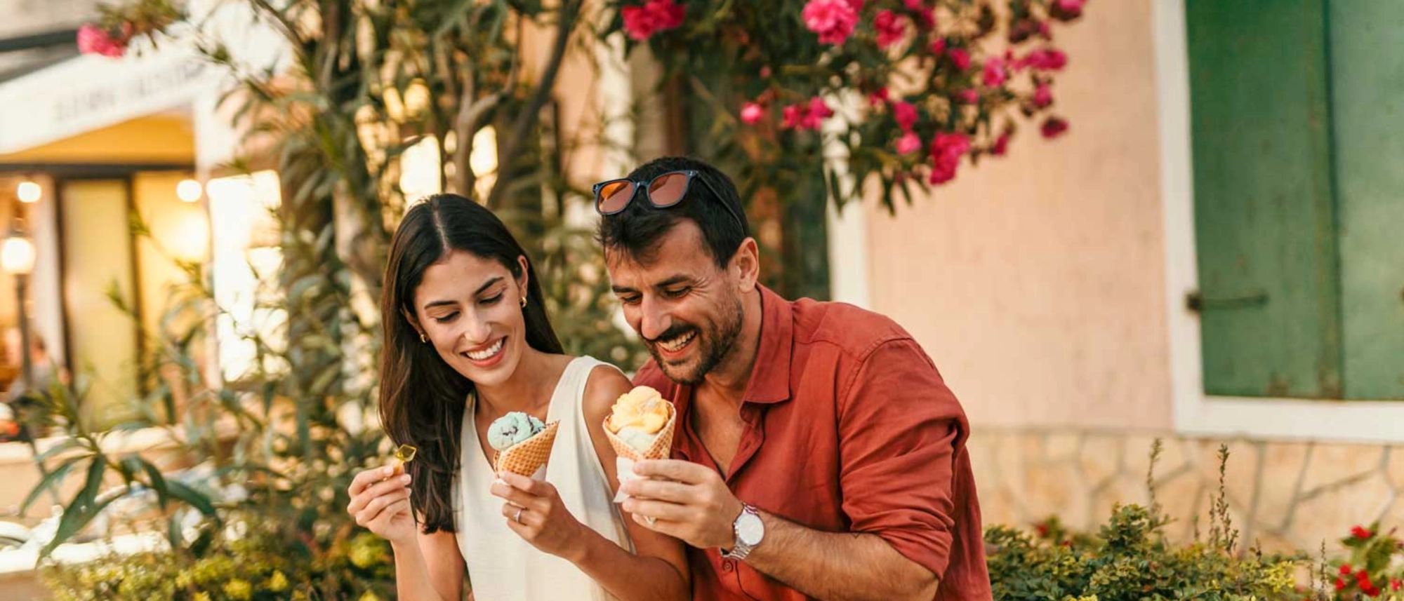 Young couple on vacation enjoying ice cream