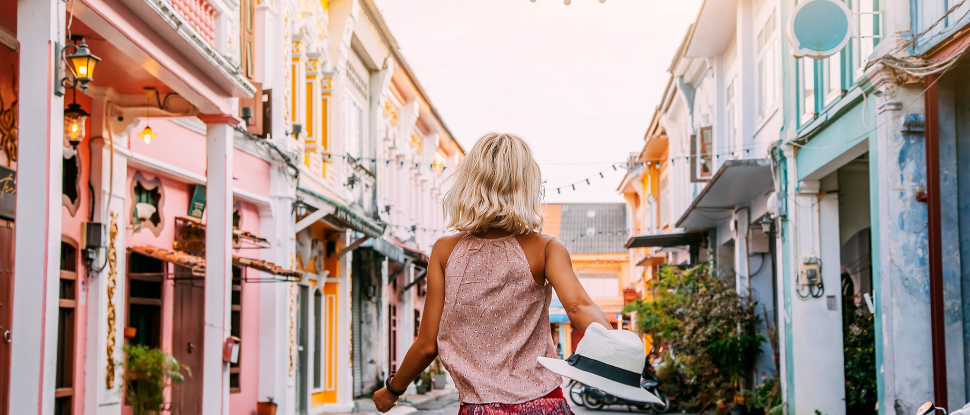 Girl Walking Through City Street